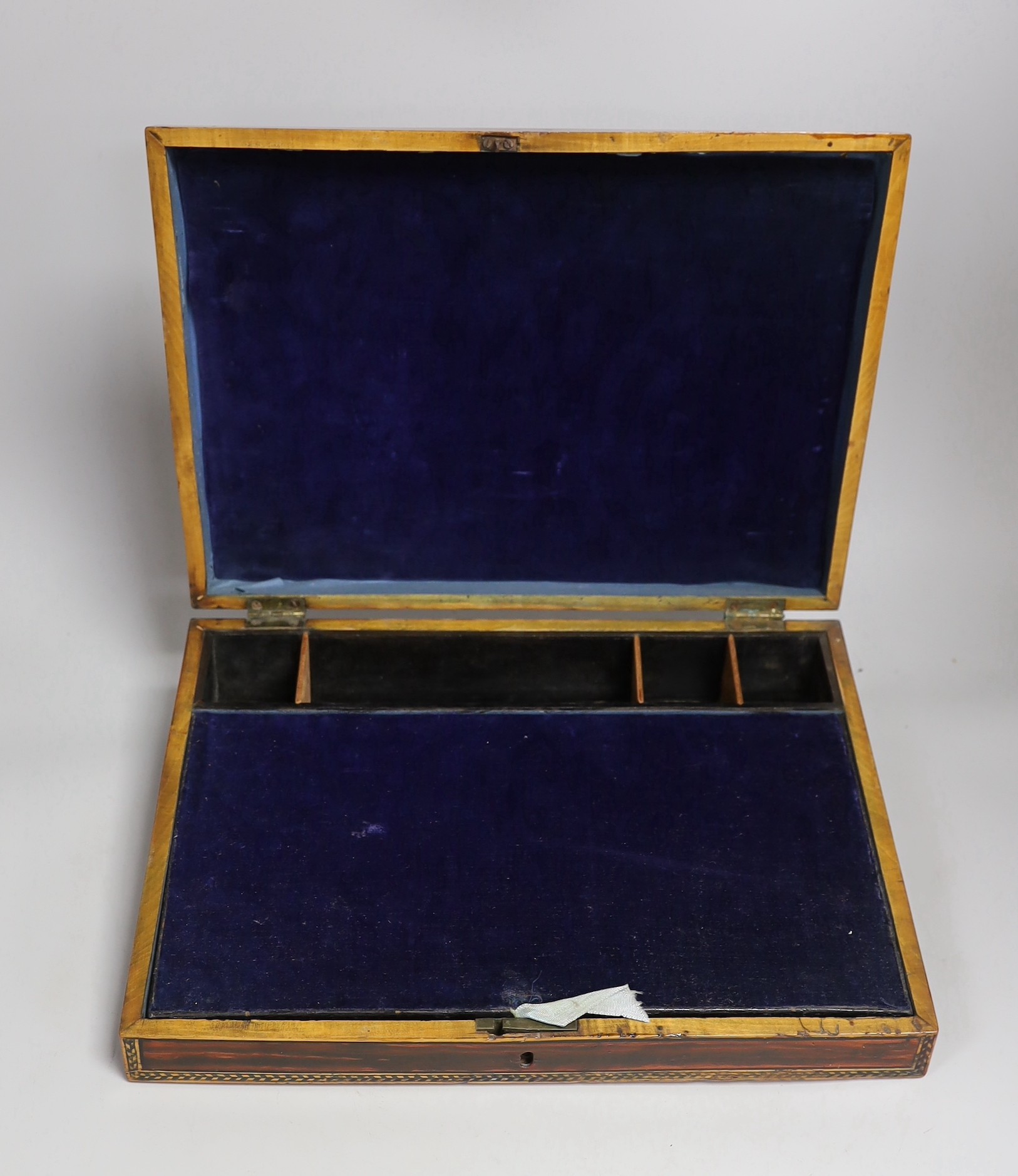 An early Tunbridge ware writing slope decorated with a scene of Brighton seafront and chain-pier to the cover. 36cm wide